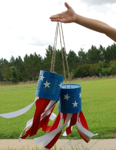 Blue star tin can windsocks with red and white ribbons