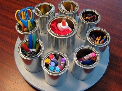 Silver tin can rotating art supply organizer
