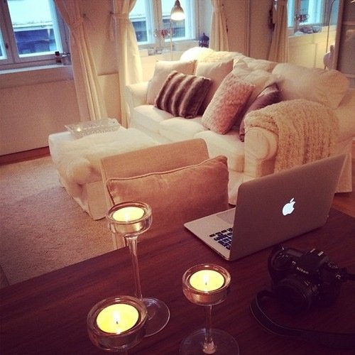 Desk with laptop camera and candles