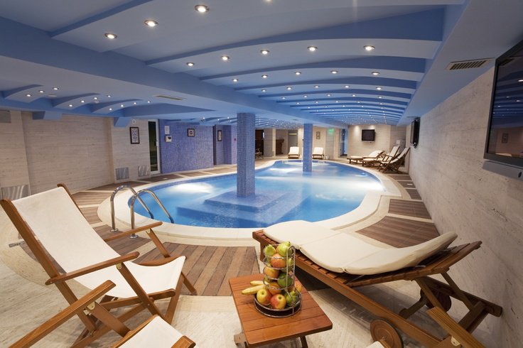 Indoor pool with garden views