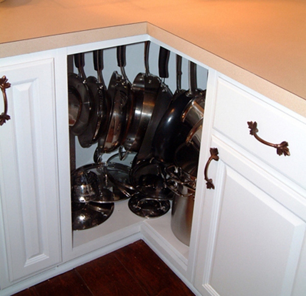 Fill awkward corner cabinets with pots and pans, using hooks or lazy susans.
