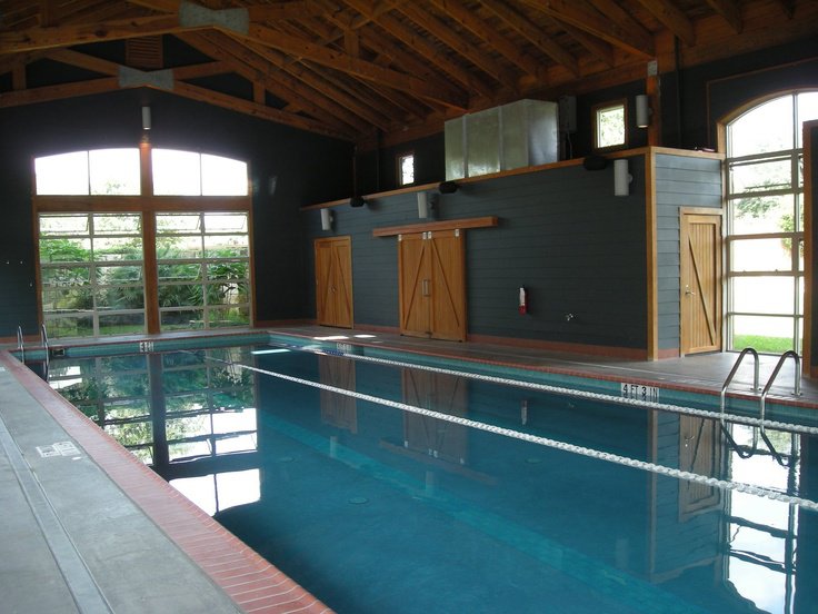 Spacious indoor pool with seating