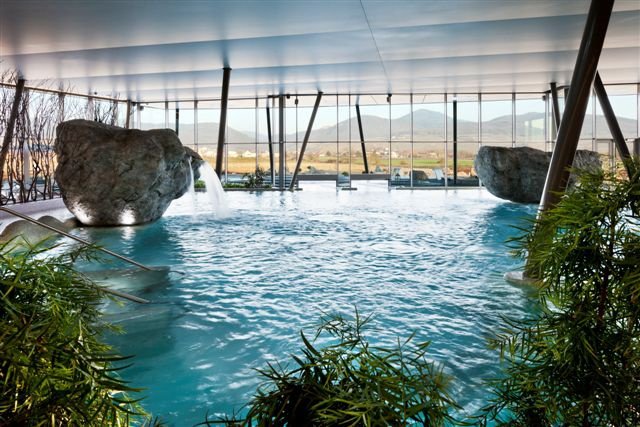 Modern indoor pool with lounge area