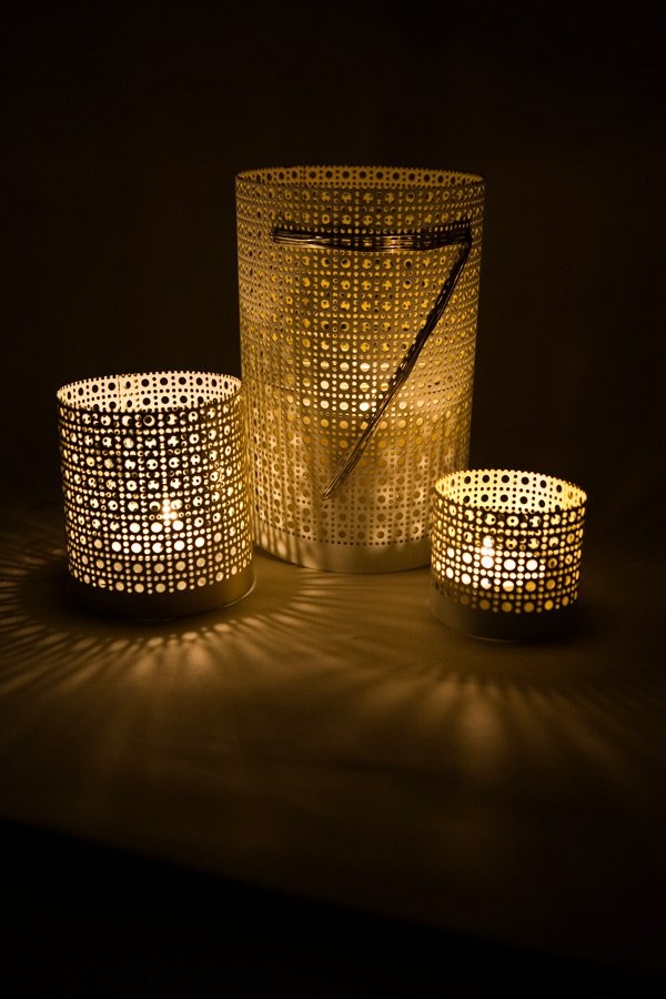 White perforated tin can lanterns