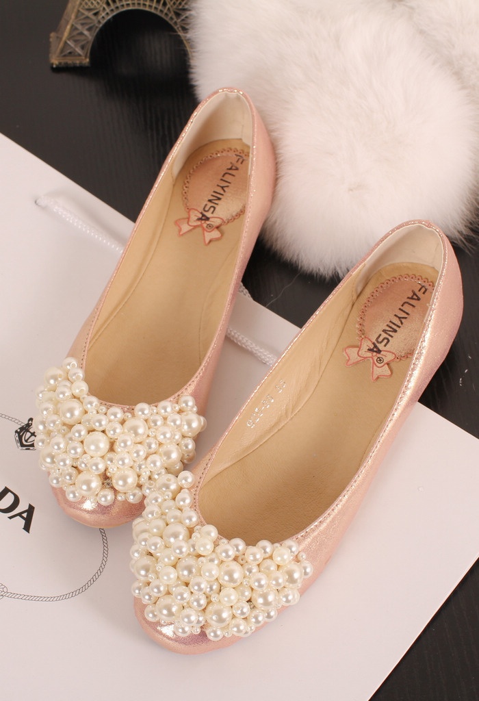 Close look at pearly wedding footwear