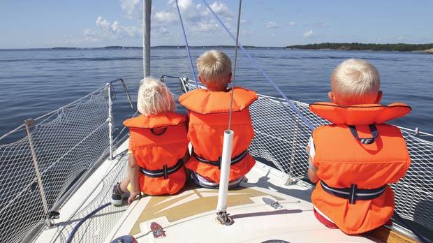 Boaters reviewing safety gear before departure
