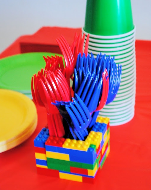Utensil holder built from LEGO bricks filled with colorful forks