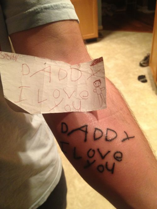 Child handwriting Daddy I love you forearm tattoo