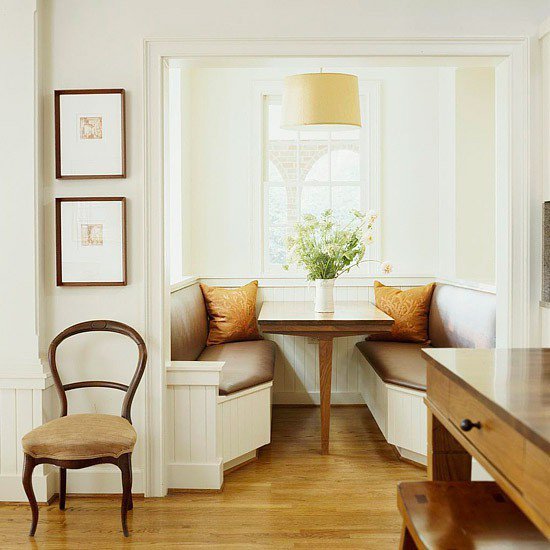 Beadboard alcove banquette with square pedestal table
