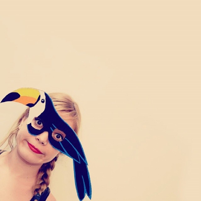 Toucan cardboard mask with yellow orange beak