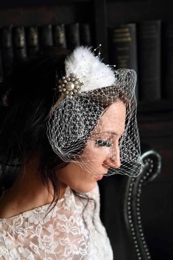 Birdcage veil with a strapless wedding gown