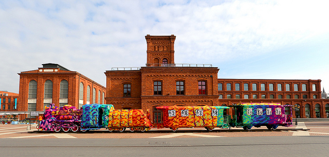 Wide view of Olek yarn-bombed train