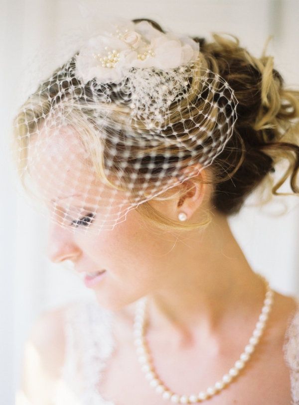 Birdcage veil and lace dress pairing