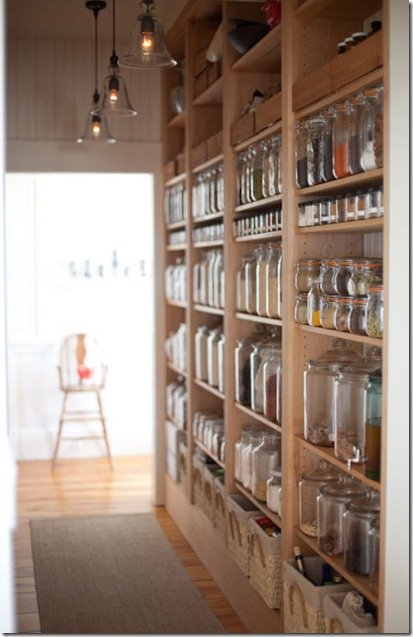 Final pantry organization example with tidy shelves and containers