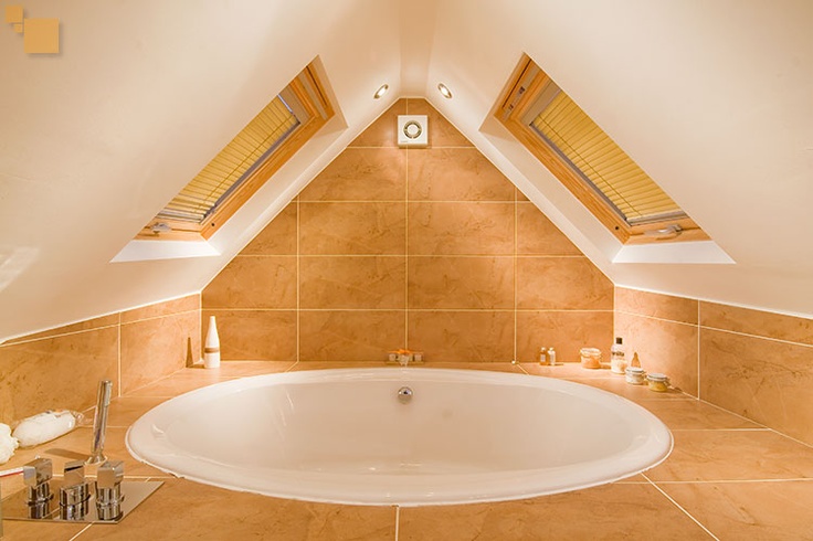 Attic bath tucked under roof angles