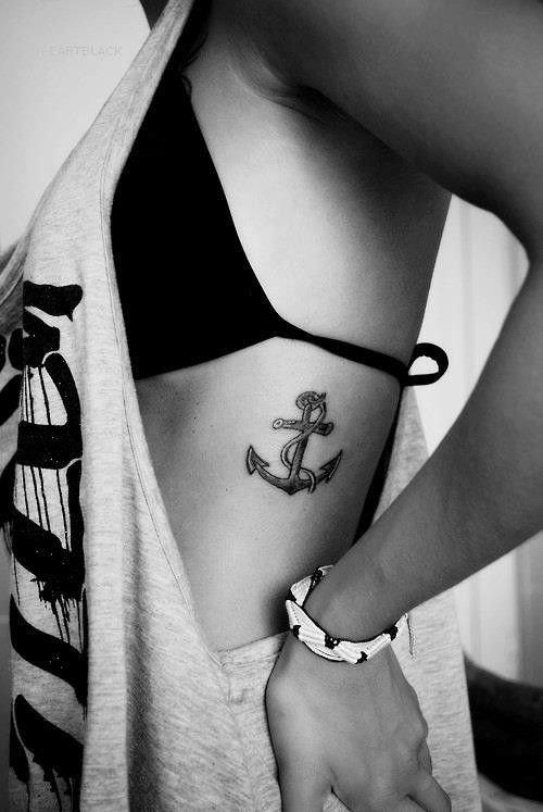 Arrow rib tattoo