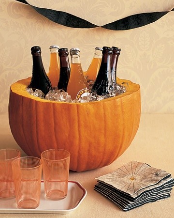 Hollowed pumpkin used as ice bucket for soda bottles
