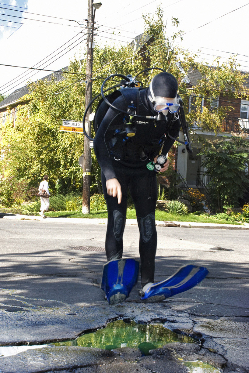 Humorous pothole scene by the photographer couple