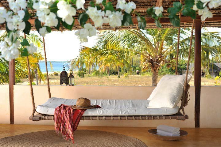 Wide floating bed in bright interior