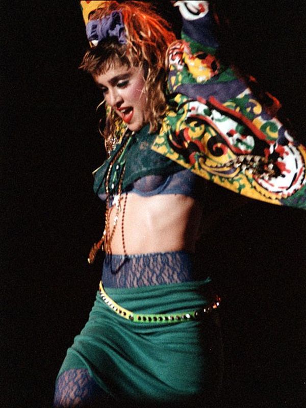 Madonna performing in layered 1980s stage style