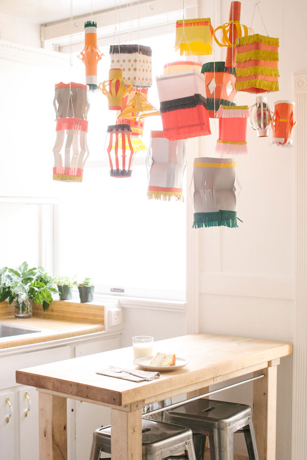 Homemade paper lanterns hanging in a cluster