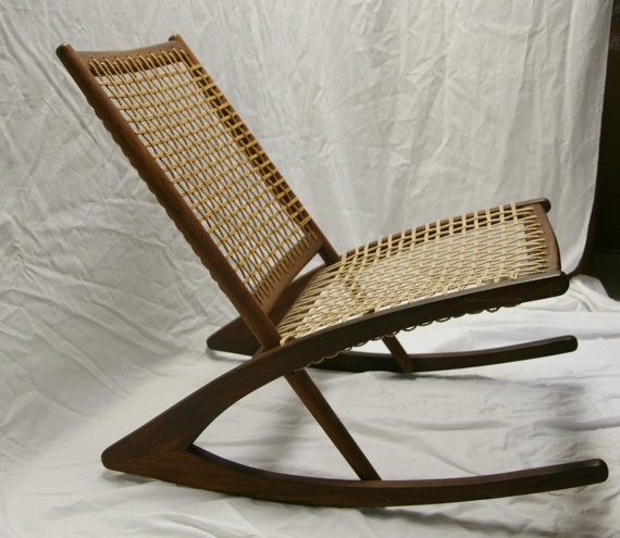 dark wood rocking chair with woven cord seat and back