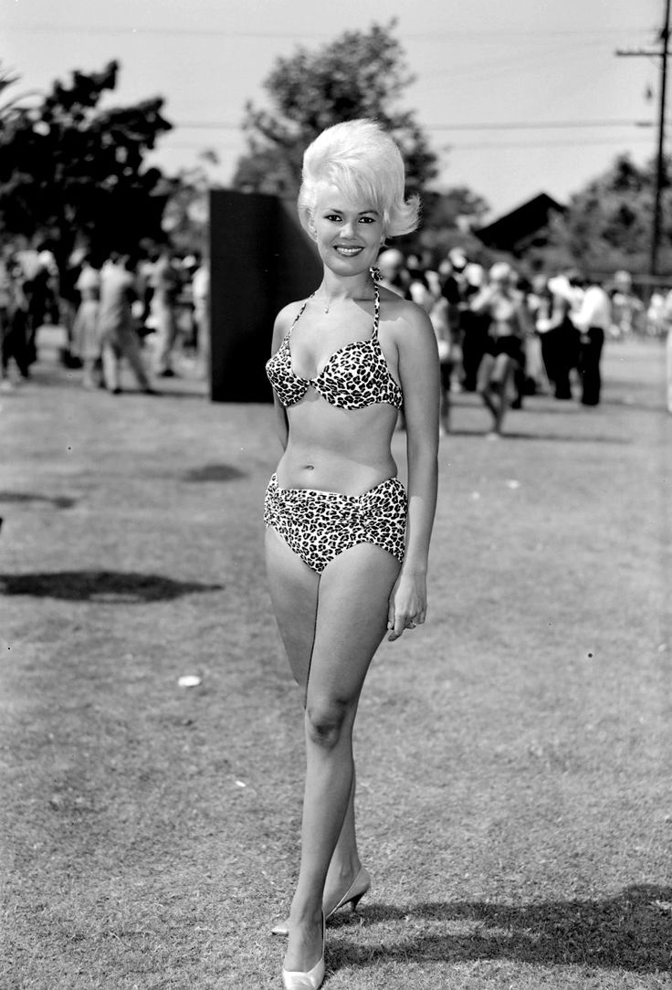 Vintage seaside figure against bright sky