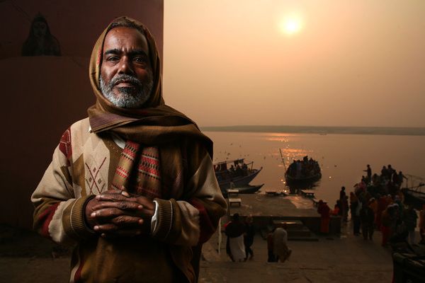 awesome-india-photos05 Man in patterned sweater by the river at golden hour