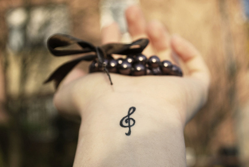 Matching couple music tattoos