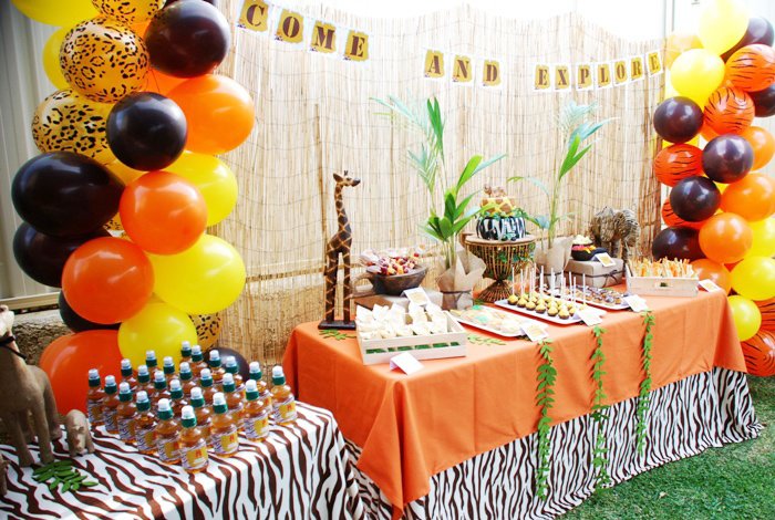 Tropical balloon and greenery styling