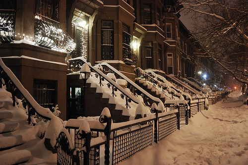 Snow falling over a city