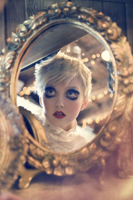 Artistic depiction of a woman through mirrored surfaces