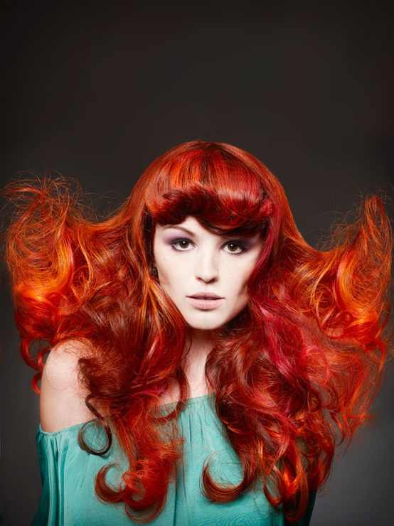 Deep red hair with sleek styling