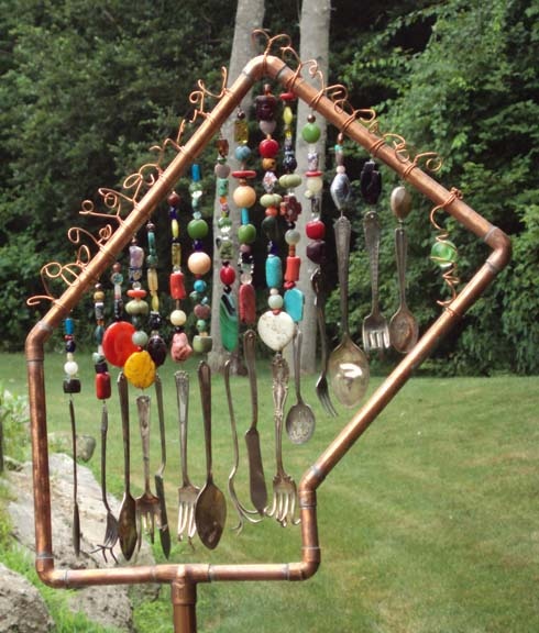 Copper house frame with beaded silverware strands