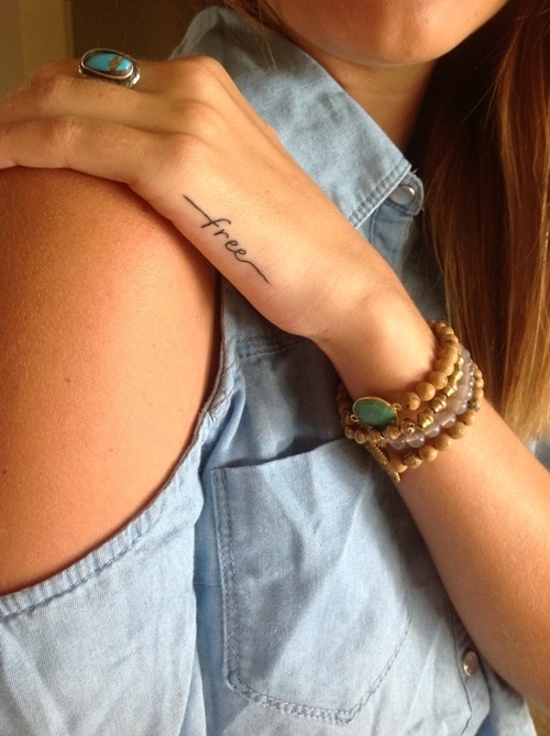 free hand script tattoo