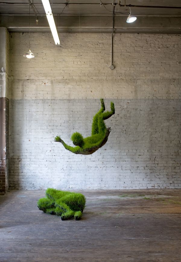 Mathilde Roussel grass figure suspended in gallery
