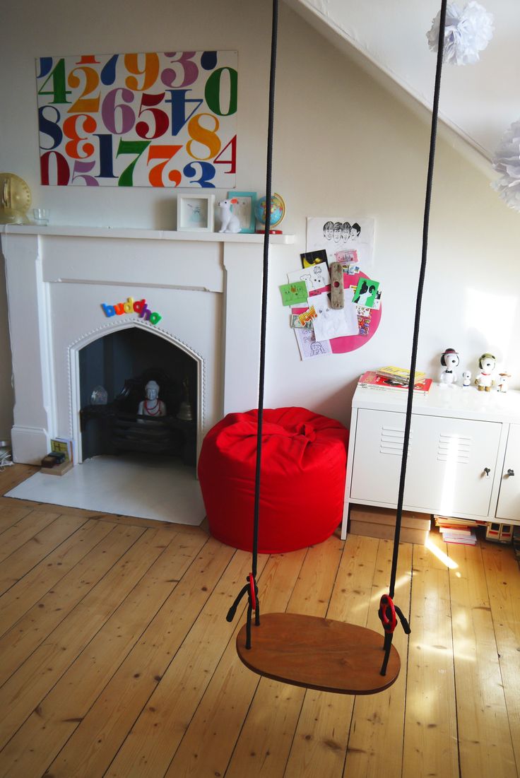 Indoor wooden swing in a bright room