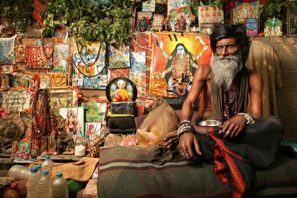 awesome-india-photos02 Holy man with a monkey before deity posters