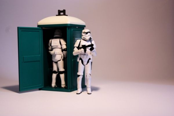 Stormtrooper inside a toy porta-potty while another stands guard