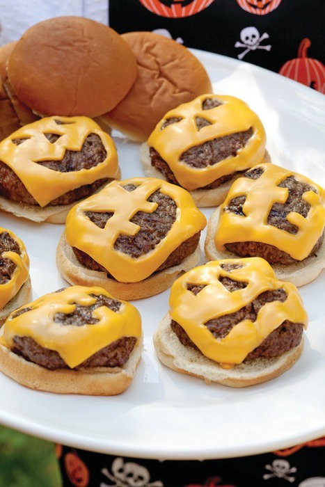 Cheeseburger sliders with jack-o-lantern cheese faces