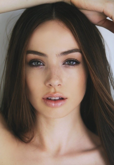 Natural makeup with soft brows and lips