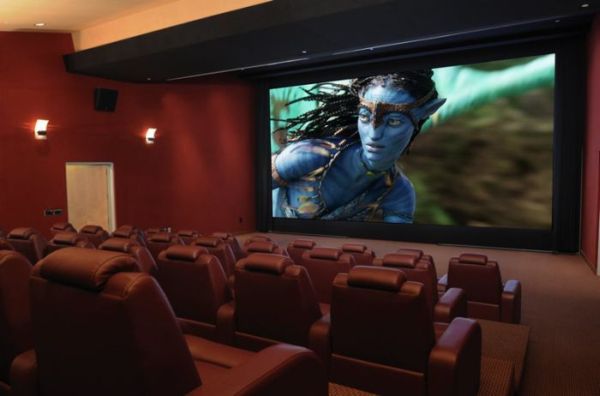 Dark cinema lounge with plush chairs