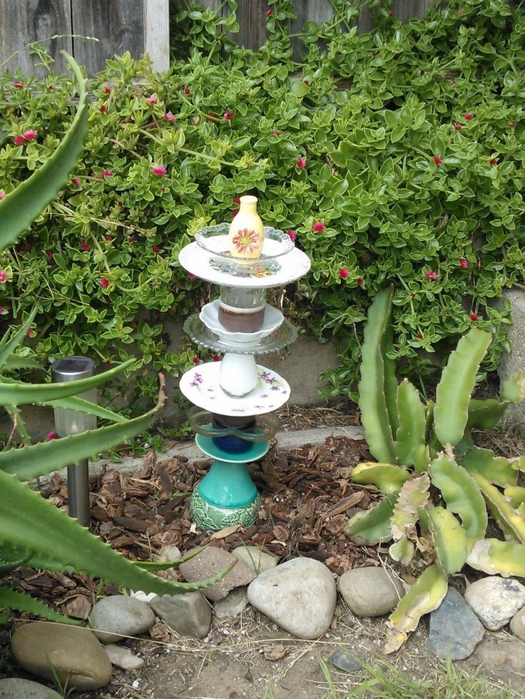 Stacked plate and bowl garden totem