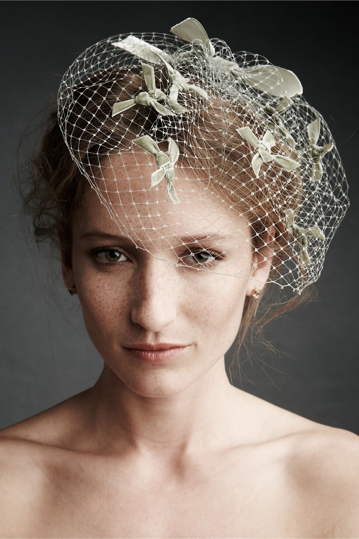 Close portrait of a birdcage veil with delicate netting over the face