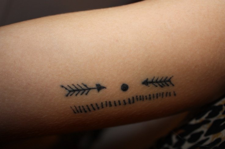 Geometric arrow tattoo design