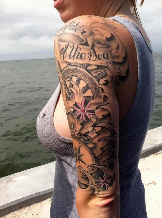 Detailed women’s sleeve tattoo