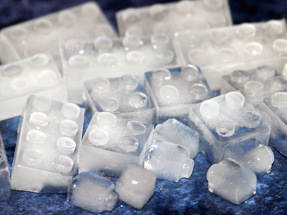 LEGO brick shaped ice cubes on a blue surface