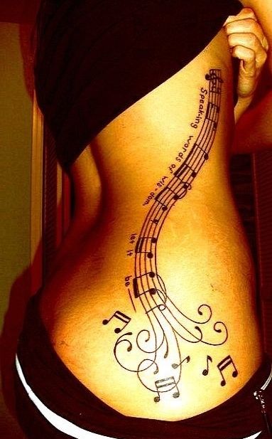 Abstract music burst tattoo