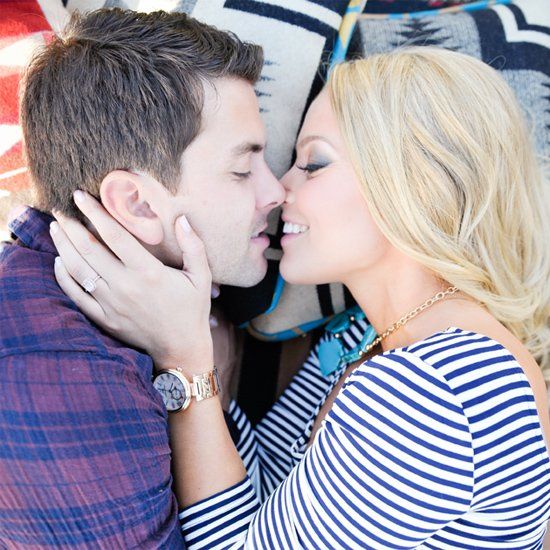 Square-framed picnic engagement moment
