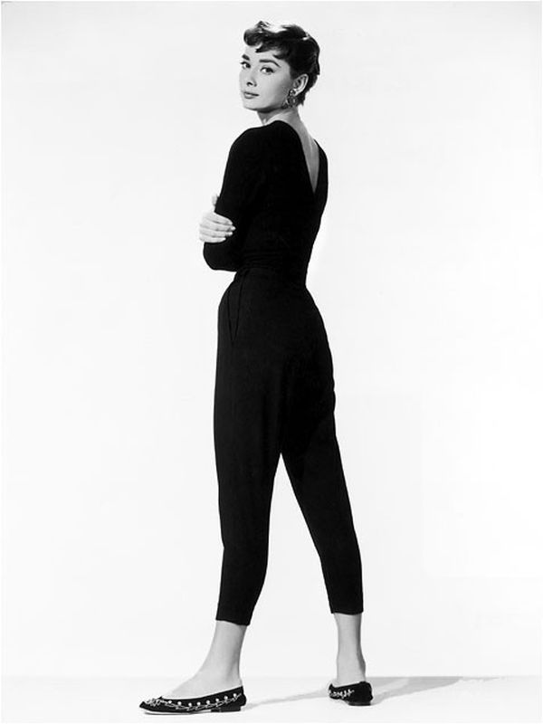 Audrey Hepburn in black top and slim trousers
